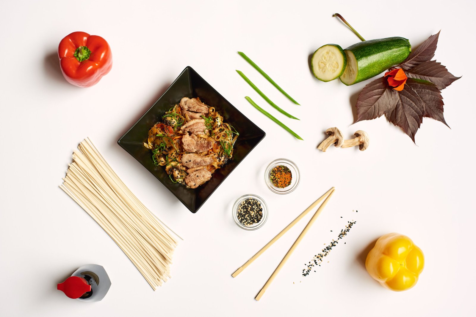 close up of still life on white tablecloth from above.